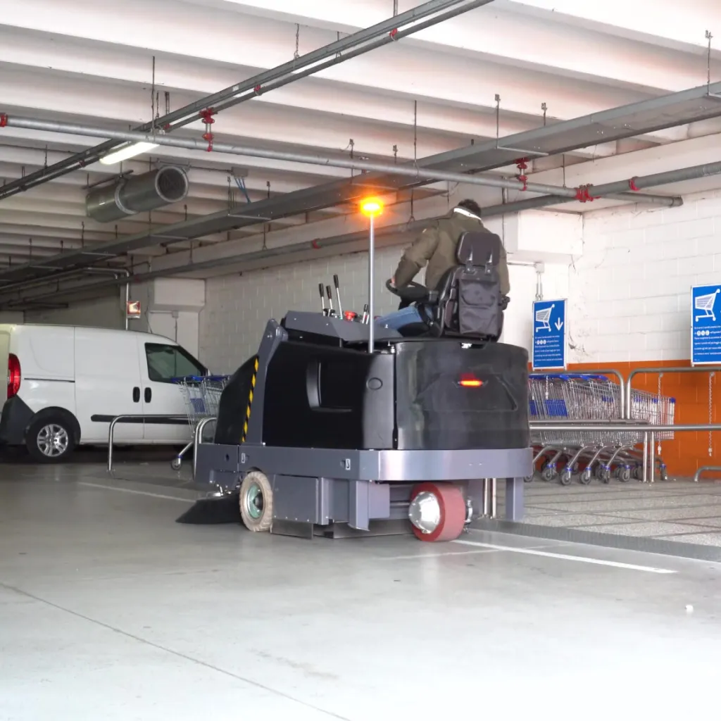 OneSweep 90 Sweeper cleaning a car parking